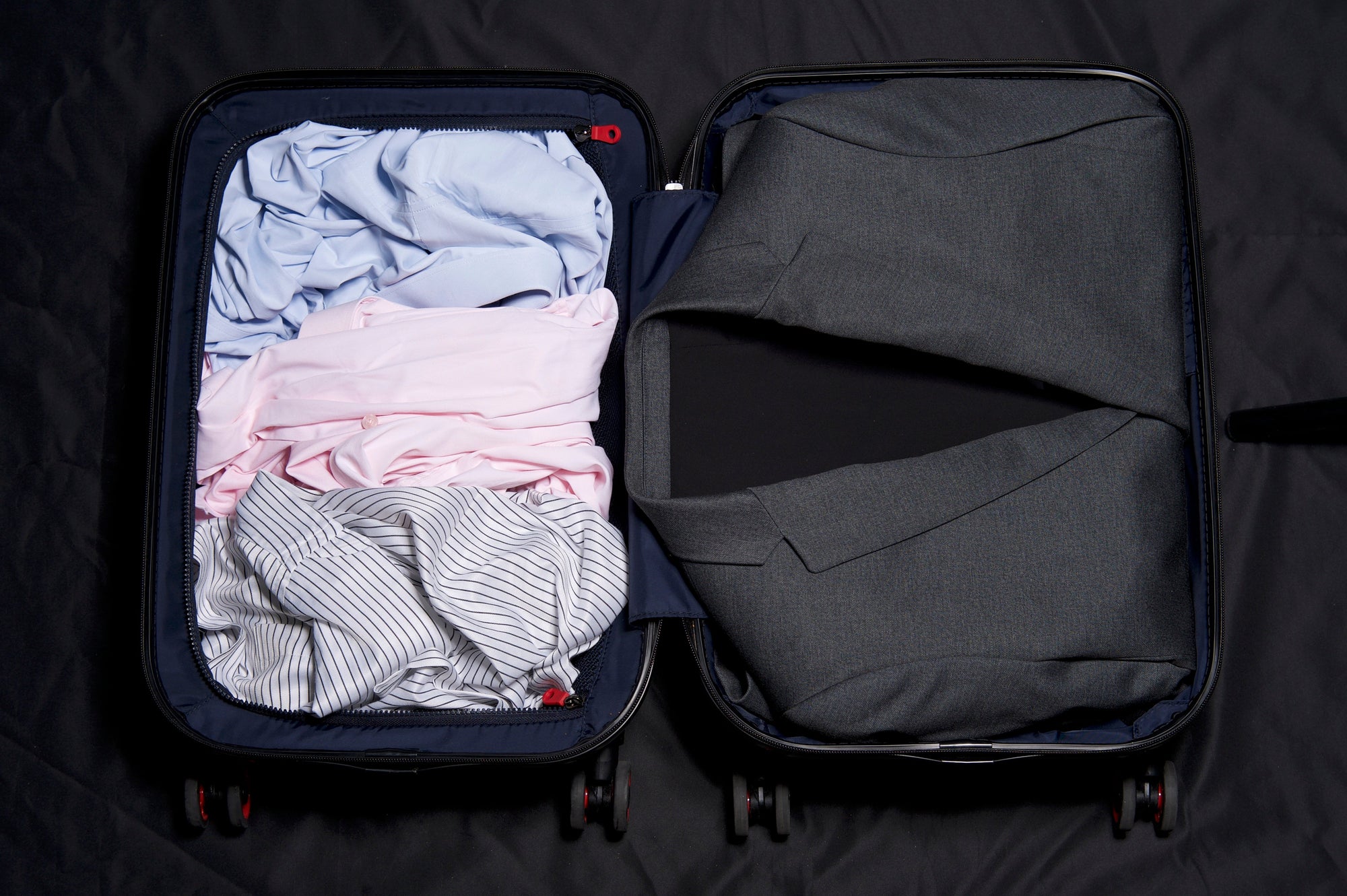 How to Pack a Business Suit for Travel - XSuit
